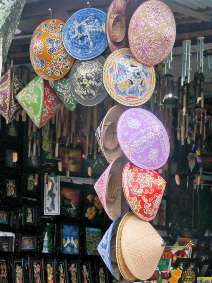 Anyone who has ever visited Bali I am sure will tell you that with every Temple there is the opportunity to shop. It is no coincidence that a little market is either at the entry or exit to all significant sites. This is how these small family communities make ends meet. No pressure to buy here though,this little village looked very well to do; I would even say bordering on commercial.  These hats just sung out to me to take their picture.
