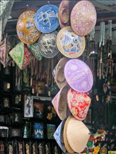 Anyone who has ever visited Bali I am sure will tell you that with every Temple there is the opportunity to shop. It is no coincidence that a little market is either at the entry or exit to all significant sites. This is how these small family communities make ends meet. No pressure to buy here though,this little village looked very well to do; I would even say bordering on commercial.  These hats just sung out to me to take their picture.: by mrsgee, Views[263]