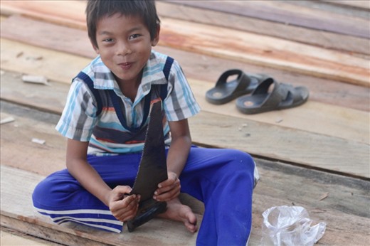 

A little boy plays with a saw near a construction site in Paser, Borneo. When warned he might get hurt he replied, 'I must get used to these things. They told me these will be my toys in the future.'
