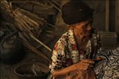 An old woman diligently paints batik patterns on cloth in a half built house in the village of Bantul, DIY. She earns five $2-5 for each batik cloth, which is then sold to the middleman who sells it to public markets and foreigners for $30-50.: by msromilab, Views[749]