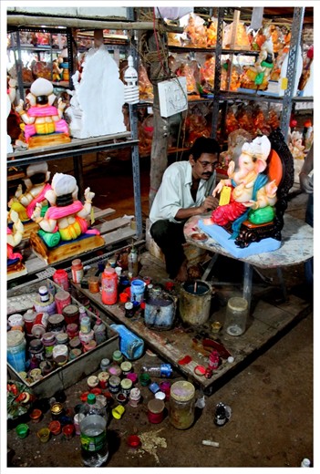 In India, you don't always need to travel to find God - he comes home ever Ganesh Chaturthi. Here, we see Lord Ganesha moortis in the making. Captured for life at Mumbai, India. 