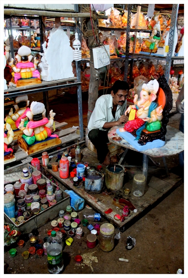 In India, you don't always need to travel to find God - he comes home ever Ganesh Chaturthi. Here, we see Lord Ganesha moortis in the making. Captured for life at Mumbai, India. 