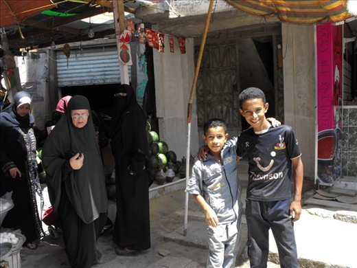 This was an spontaneous shot and I love it. Women stared at me (photocamera in hand) with distrust while walking through this Street market in Suez. Suddenly this two kids jumped in front of me screaming 