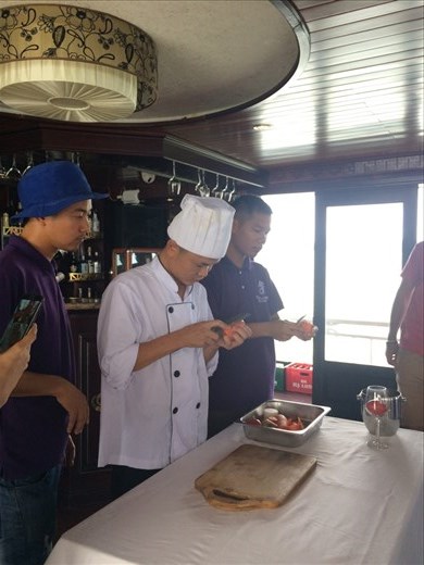 Then we had a cooking demonstration where the chef showed us how to make a carrot net (it was the garnish for our fish plate the night before) and vegetable flowers.  