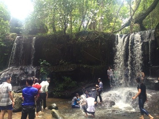 Playing in waterfalls in the Cambodian jungle