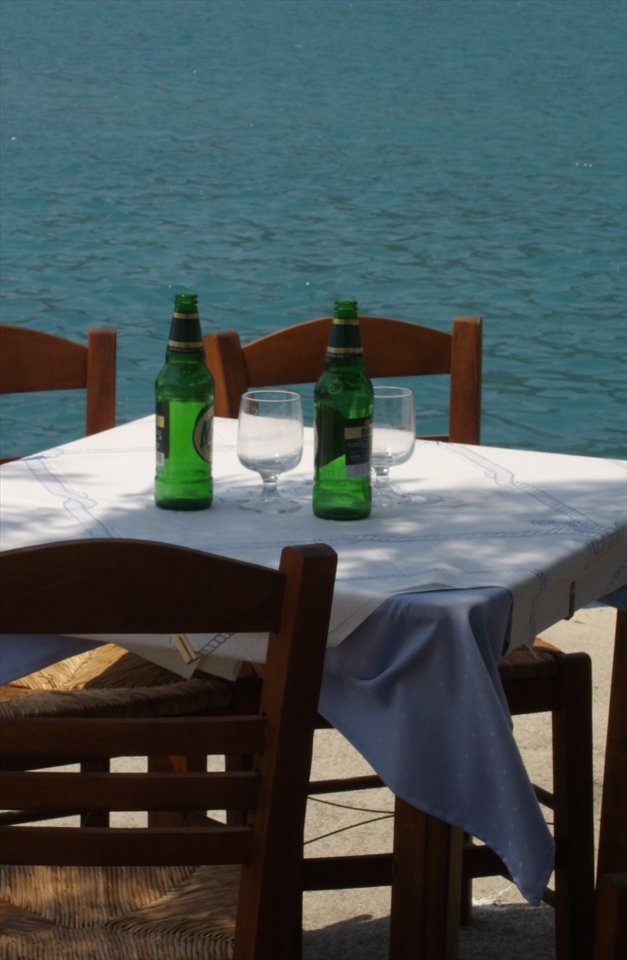 a must do while in a greek island. drink a frozen beer in a small tavern near the sea..