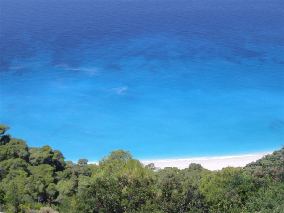 sparkling blue waters, golden sand and nature all around. a place like heaven...