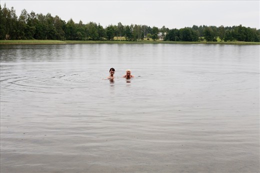 My sister and my mom are having a swim under the rain.