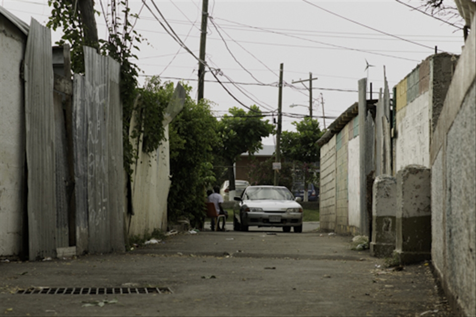 Today things are relatively peaceful, compared to a few years ago when a young man was shot and killed in broad day light by a lone gunman while walking on this street. Although the blood stains have since been washed away the events of that morning will forever soak into the minds and culture of the residents of Swallow Field. 