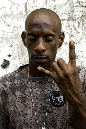 Sean Kelly is an aspiring rapper / singjay who has an affinity for tattoos. Sean has big plans for himself and a rather intriguing outlook on life, but like most youths who live within a garrison community they are left behind due to a lack of opportunity and guidance. Youths like him spend most of their days weighing out their options which are few. 