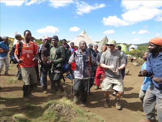 SENE staff of guides, cooks and porters greeting us to camp with singing!