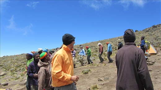 The SENE crew meeting us with song and dance at Arrow Glacier Camp!