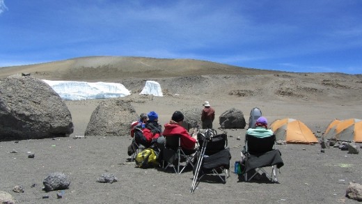 Lunch in the crater ...we were given the choice to camp here overnight with an 80% chance to summit in the morning OR since it was a rare, clear afternoon we could summit this afternoon with a 100% chance of making it.  I'm no dummy ... even though I could barely breath and was exhausted, I chose today! I've been dreaming about reaching this summit for 20 years ... 100% sounds GREAT to me!!!