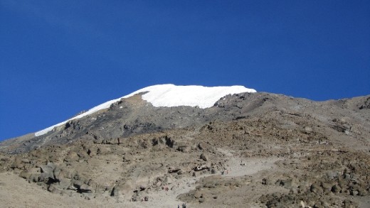 After the summit we had a brutal 4 hour hike down skree and rocks to Barafu Camp (no photos because I was crazy exhausted!)  Thank goodness for Frank for having my tent set up so all I had to do was fall inside, take off my boots and the SENE crew brought me hot water to wash up and dinner to my tent.  After 12 hours of climbing/hiking I have NEVER been that exhausted in my life! This photo is the view of Kili the next morning from Barafu camp!