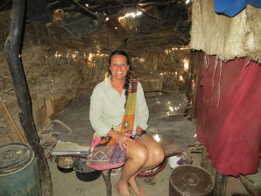 Inside the hut on the bed.