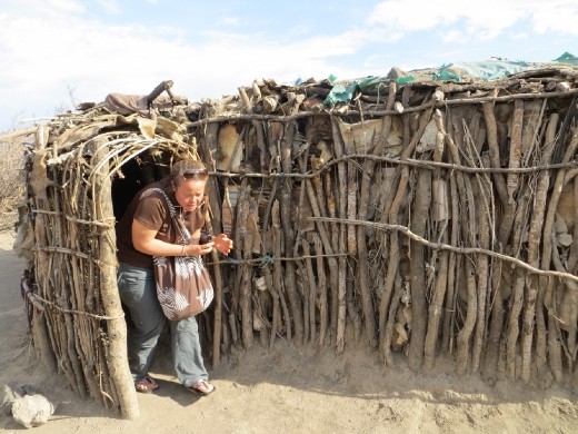 Lynn coming out of the hut.