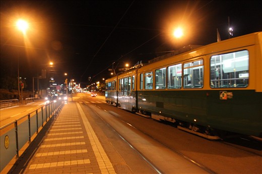 night at the middle of he road of helsinki with the trem aside
