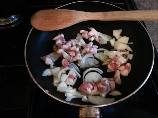 Stir frying the guanciale with the onion