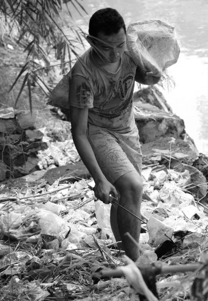 17year old child is currently taking and collecting  trash,garbage,bag it and sell it to get money for his life