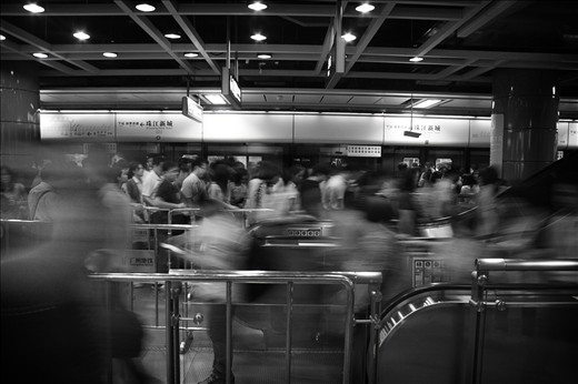 nameless faces travelling through Guangzhou's bustling subway