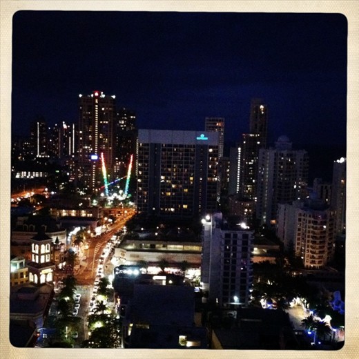 Surfers at night from the Hilton
