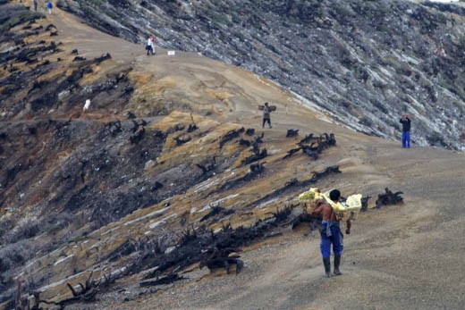 They carry the loads on their shoulders over 3 km of 40-60 degree grades