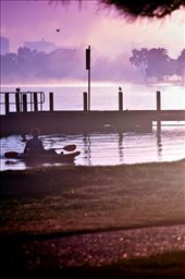 A solo canoeist reaches the shore after his early morning venture: by nans, Views[214]