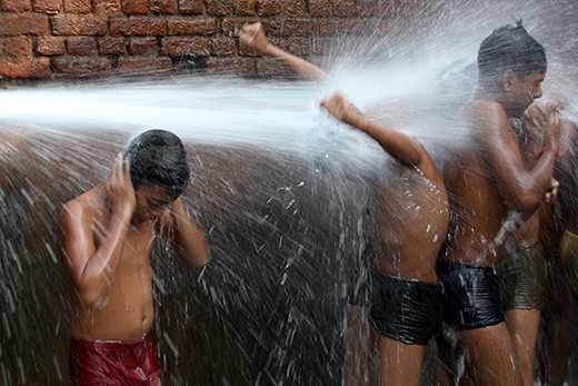 Young, very recently rescued child labourers washing