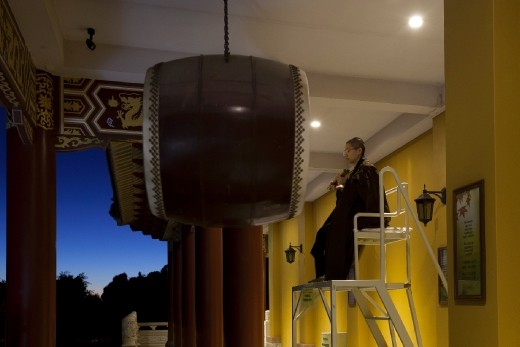 The drum begins to sound, representing the elements of wind, rain & thunder. Beating in vary in speeds to illustrate each of the elements. 
The gong is used first to awaken everyone gently and the drum is used evoke the energies for the days activities.
This welcoming of the day sounds for 15 minutes, every day. 
After the reverends have gathered at the hall entry, with the attendees inside, it is time to enter the Main Shrine.
