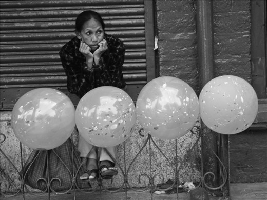 In the last couple of decades, demand from the tourism sector has resulted in big malls and luxurious hotels coming up in the hills. The commercialization has increased competition for the locals to survive along with the flourishing big businesses. Seen here is a woman waiting for customers to drop by.