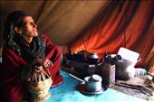 They lead a tough life high up in the mountains. Seen here is the inside of a makeshift camp. The woman is wearing a huge robe which is worn to keep the body warm. The wooden basket in her hands is called Kangar, which contains an earthen pot with burning coal inside. This basket is carried and held under the robe which keeps them warm .
: by neelima, Views[229]
