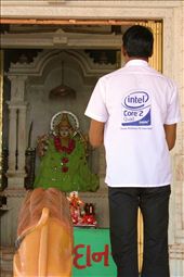 Science Surrenders - 
Ahmedabad has the blend of old values and new culture. People are very religious, maybe superstitious too, but the education in that city is one of the best in the country. Many of the country's best universities are located there. 
Tradition is tradition though. 
Managed to capture this as I saw a man opening a temple, the city streets are lined with little temples.
: by neety, Views[519]