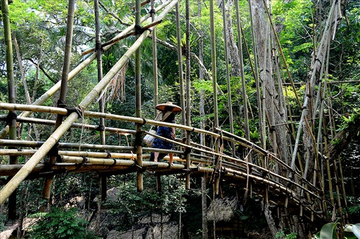 A Badui woman returning home from a days work in the rice fields. 