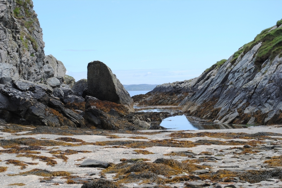 Blow holes and sea stacks.A blowhole is formed as sea caves grow landwards and upwards into vertical shafts and expose themselves towards the surface

Sea stacks can be viewed at the Stags of Inishbofin. A stack is a geological landform consisting of a steep and often vertical column or columns of rock in the sea near a coast, isolated by erosion


