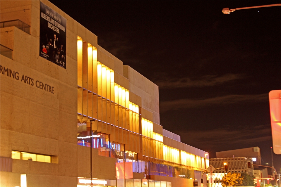 Brisbane, Aust: While waiting for the traffic lights to change as I continued home, I noticed the external lights of QPAC and realised that they mirror the internal seating layout. The taller lights matched the balconies and stalls which flowed down towards the stage.