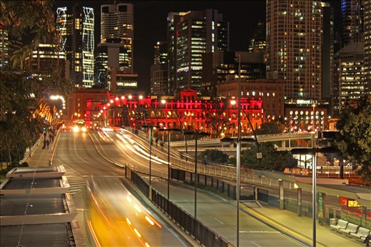 Brisbane, Aust: Flowing traffic of cars and buses between Brisbane and Southbank cultural hub looking towards the city and the Treasury building. It was a quite night as the State of Origin rugby league game between Queensland and New South Wales was occurring at the time (QLD won to level the series 1-1)