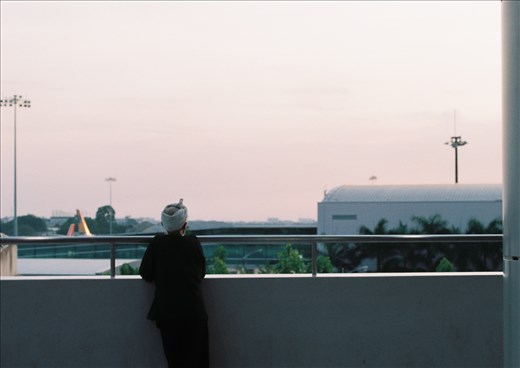 An old man at the airport watching sunset, by 35mm film