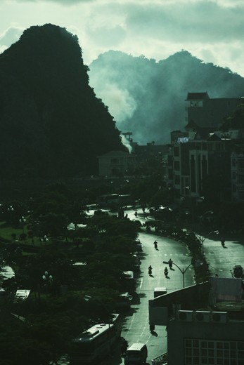Sunset in Cat Ba Island , Viet Nam

Another photo, I took it on Cat Ba Island - Hai Phong - Vietnam in August 2012. This is the sunset, I stood from the window of the hotel to take pictures. This photo I took it through a glass, so it seems that picture is blue. This is where I met these people, they are too hard and fatigue to survive. In a magnific island, tourism developed. Rich exist side by side with them.  They are poor fishermen, the orphan, thief, swindler, .... An island of everything. When you have a child, she spent long days on the beach to sell some of the crab, then it stopped and robbed of money by them thug. It is guilt and helplessness when you have no choice but to stand and remote view. Since that moment. This beautiful island with me just a blue picture.