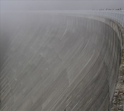 Students lined along the edge of the dam holding back Lago di Ceresole.