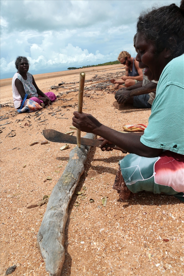 After Banthay, Basma and Simon were finished digging for sand crabs, Jennifer makes a pipe from a locally known, soft centred coastal tree. The story to accompany her work had everyone laughing while the tide went out.