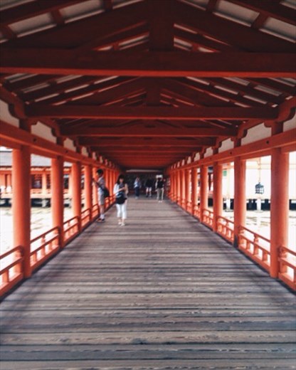 The Shinto Shrine on Miyajima Island. Stunning orange temple build over the ocean on stilts. 