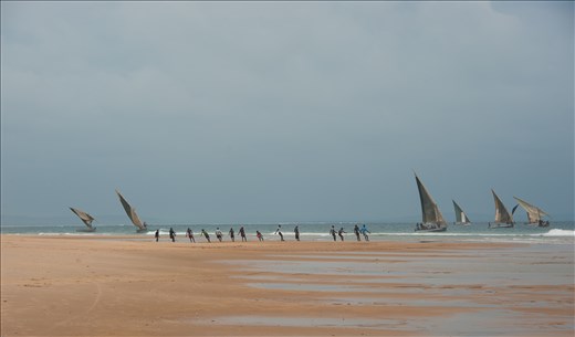 Hauling. 14 boys to haul in the fish, with the waves, until reaches beach.