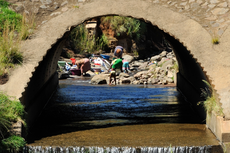 Doing Chores. The women don’t have running water or washing machines to do their washing, which we take for granted. 