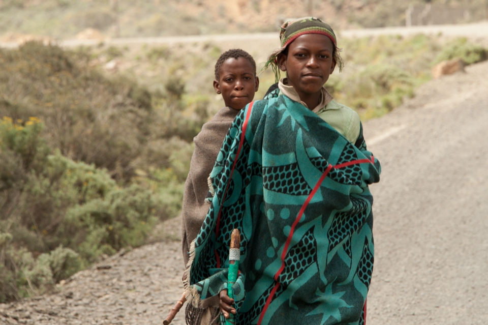 Where boys are men. If you don’t have a horse or donkey you have to walk long distances, like this boy waking with his friend behind him. It’s traditional that they wear blankets, walk with sticks and and have a hat. 