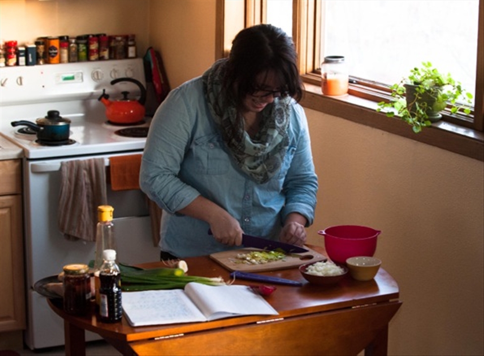 Me chopping vegetables to prepare nasi goreng, an Indonesian fried rice