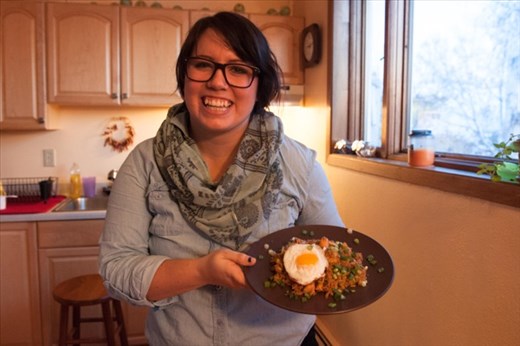 Me showing off a finished plate of nasi goreng, complete with fried egg