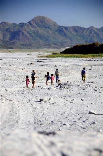 The Displacement -- In June 1991, Mt. Pinatubo erupted and forced the Aetas, the indigenous people most affected by its explosion, to flee from the mountains. Here, Aetas until now take a long hot journey to nearby towns either to find new beginnings or to replenish their supplies. 