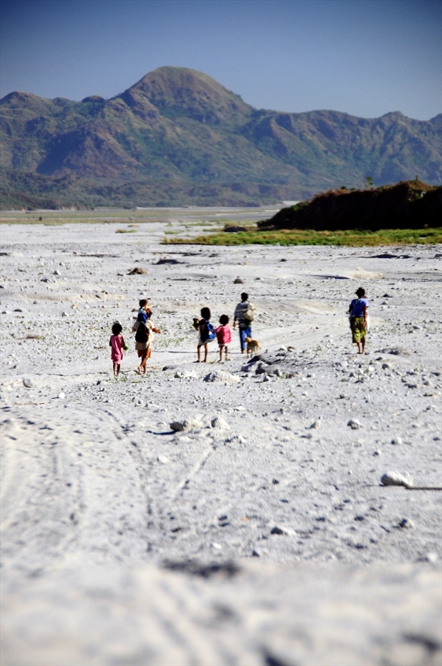 The Displacement -- In June 1991, Mt. Pinatubo erupted and forced the Aetas, the indigenous people most affected by its explosion, to flee from the mountains. Here, Aetas until now take a long hot journey to nearby towns either to find new beginnings or to replenish their supplies. 