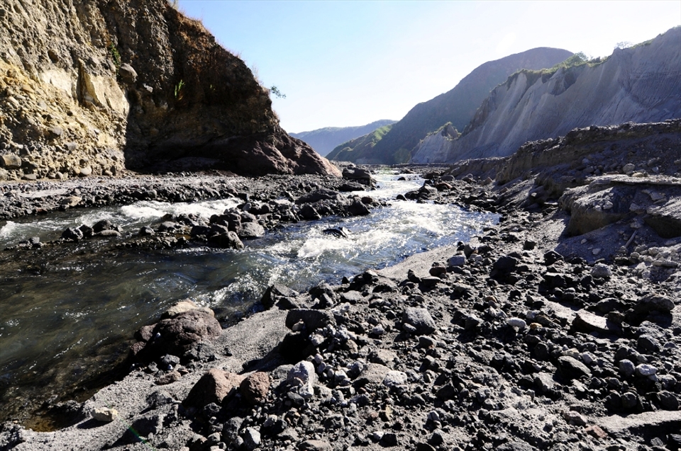From Ashes, Comes Life -- Though most of the trek was unbearable because of the heat of the sun (not to mention the added temperature because of the reflecting white ash), the cold water coming from the mountain replenishes the land.