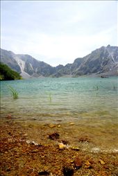 After an hour of walking in the desert, and an extra 30 minutes of climbing to the top, Pinatubo welcomes trekkers with this vision. The crater contains highly mineralized water, and due to the water's sulfur content, there is a distinct yellow discoloration of the rocks that blends with the blue color of the lake. It is unbelievable that this was once the mouth that spewed chaos in the northern part of the archipelago, and changed hundreds of Filipinos' lives forever. : by nicole_0809, Views[732]